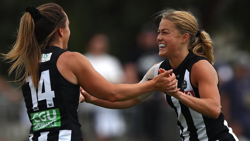 Sarah Rowe (R) celebrates her goal