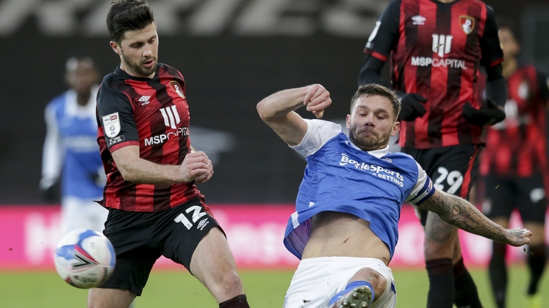 Harlee Dean of Birmingham City challenges Shane Long