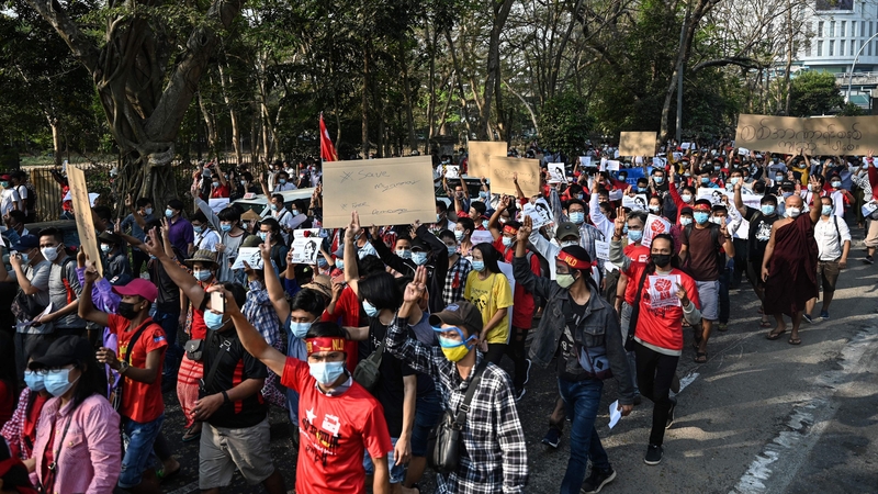 Protesters march during a demonstration against the military coup in Yangon