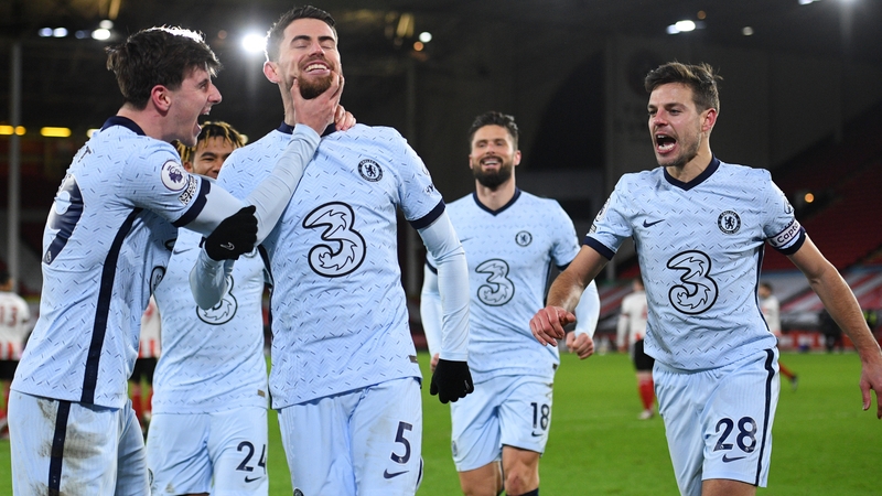Jorginho is mobbed after scoring the match-winning penalty