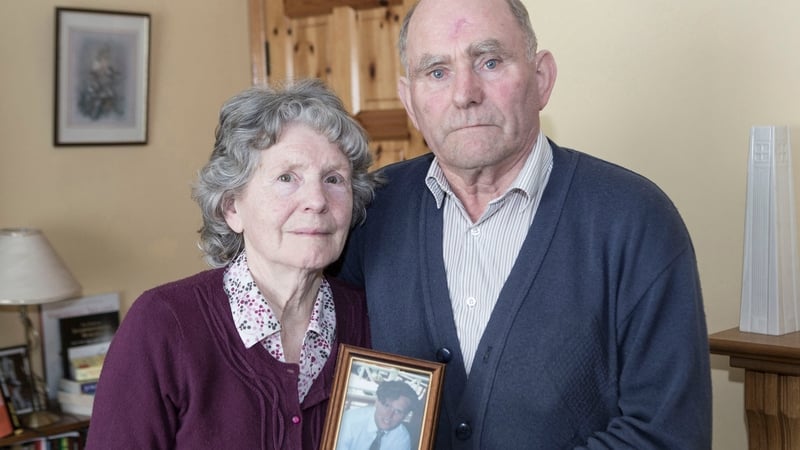 Mary and Denis Walsh Snr with a photo of their son Denis, who went missing in March, 1996