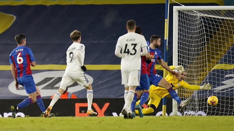 Patrick Bamford beats Vicente Guaita of Crystal Palace to score their teams second goal
