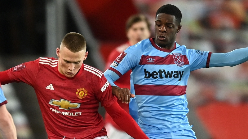 Scott McTominay battles with Mipo Odubeko at Old Trafford