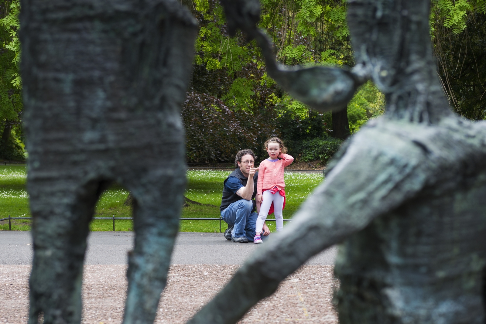 A father explains the meaning of the Famine memorial in St Stephen's Green by Edward Delaney in St Stephen's Green, Dublin. Photo: Getty Images