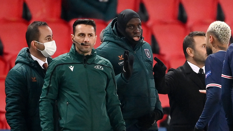 Fourth official Sebastian Coltescu (2nd-L) looks on next to Istanbul Basaksehir's Demba Ba (2nd-R) and Paris Saint-Germain's Neymar