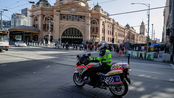 A policeman patrols on a motorcycle in Melbourne after authorities ordered a five-day state-wide lockdown