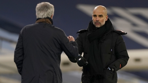 Manchester City manager Pep Guardiola (R) greets Spurs boss Jose Mourinho after the game