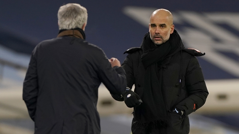 Manchester City manager Pep Guardiola (R) greets Spurs boss Jose Mourinho after the game