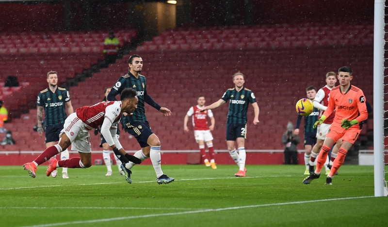 Aubameyang dives to head home his third goal.