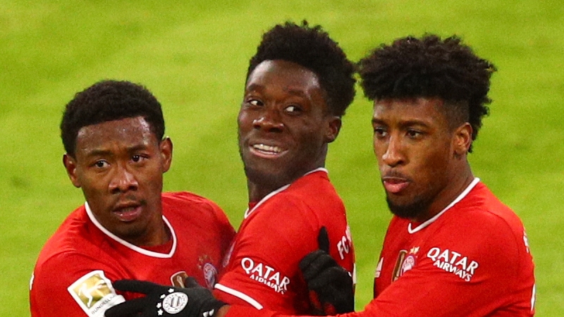 Alphonso Davies (C) celebrates his equaliser with David Alaba (L) and Kingsley Coma