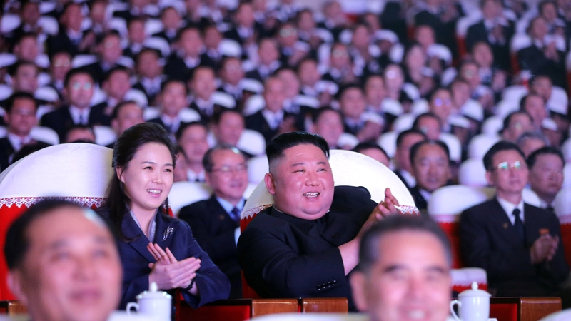 A photo released by the official North Korean Central News Agency Leader of North Korea Kim Jong-un (C-R) and his wife Ri Sol-ju together with members of the Party