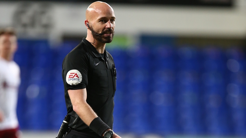 Referee Darren Drysdale leaned his head towards Ipswich's Ireland midfielder Alan Judge