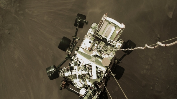 A shot from a camera on the rover's 'jetpack' captures it in midair, just before touchdown (Images: NASA)