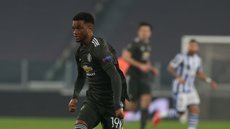 Amad Diallo in action against Real Sociedad on his debut with Harry Maguire watching on in the background