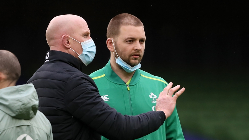 Iain Henderson (R) speaks with forwards coach Paul O'Connell before the France game