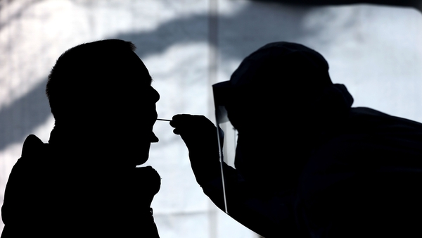 A health worker worker carries out a test for Covid-19 in Naumburg, Germany