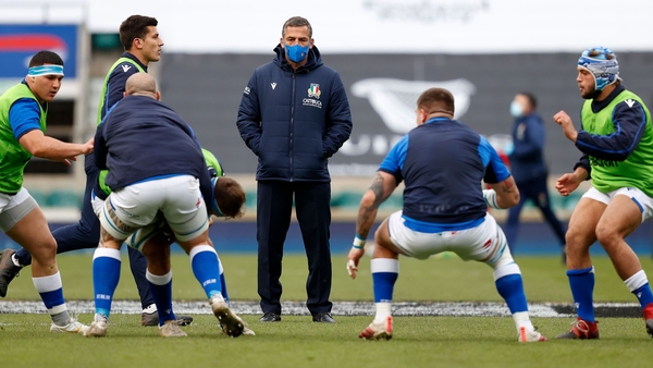 Italy head coach Franco Smith watches his players warm up at Twickenham
