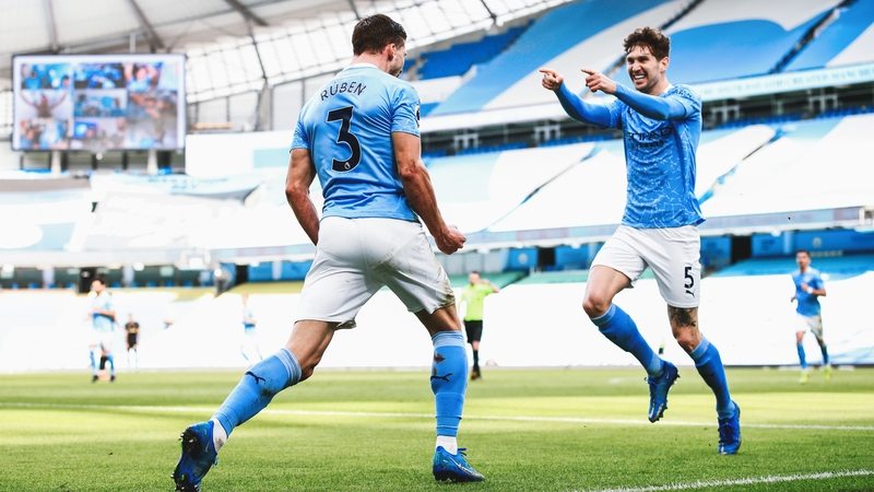 Ruben Dias celebrates with John Stones after Man City's opener against West Ham