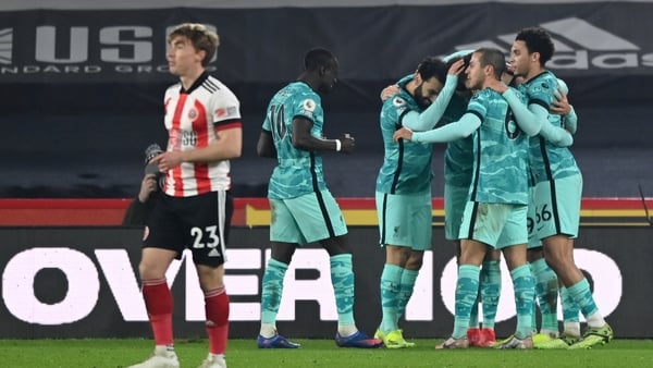 Liverpool players celebrate their side's second goal