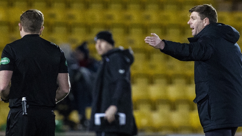 Referee John Beaton shows Steven Gerrard a second yellow card