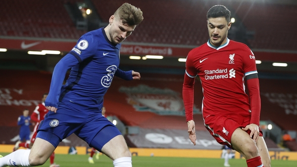 Ozan Kabak (R) in action for Liverpool last season