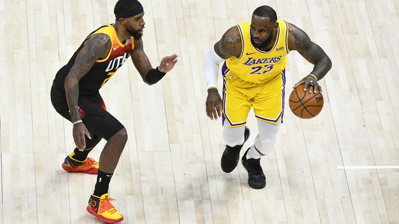 LA Lakers LeBron James (R) takes on Royce O'Neale of the Utah Jazz in Salt Lake City last month