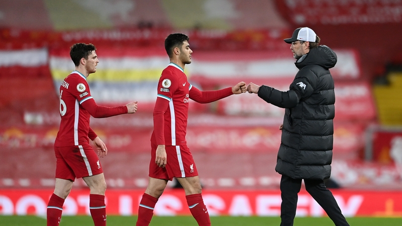 Klopp greets his players after the defeat to Chelsea