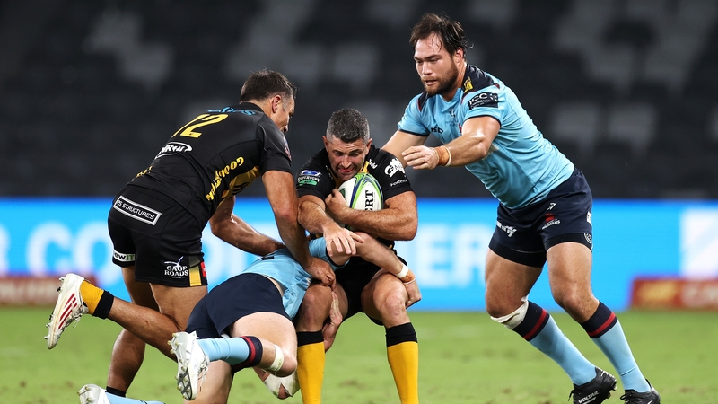 Rob Kearney is halted in his tracks by the Waratahs defence