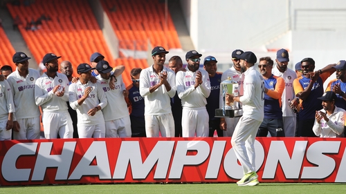 Captain Virat Kohli celebrates with team
