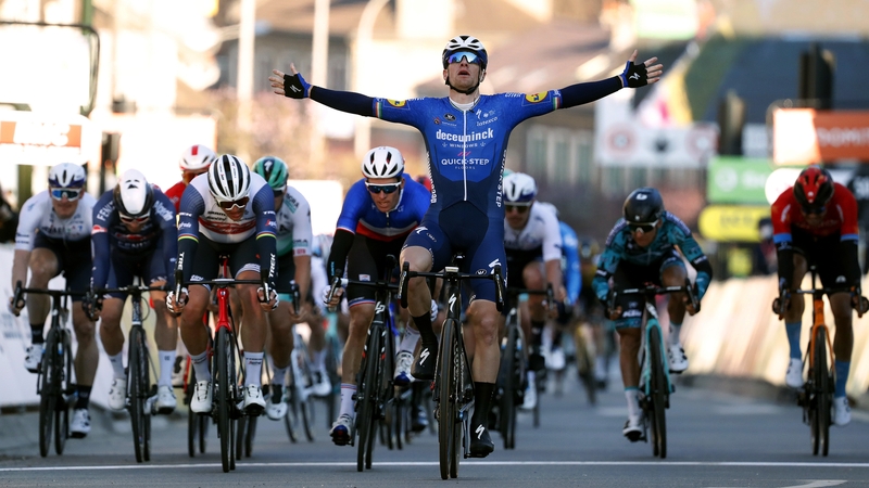 Sam Bennett crosses the line in first for Team Deceuninck - Quick-Step