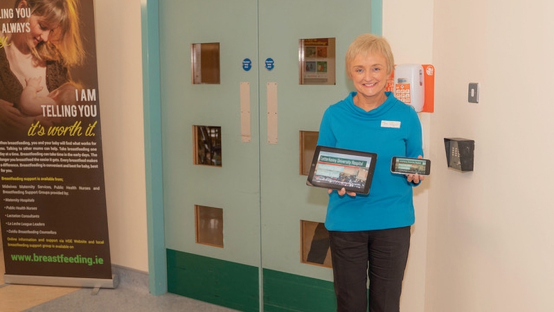 Geraldine Hanley, Clinical Midwife Manager at Letterkenny University Hospital, showing the tour on a mobile phone and tablet