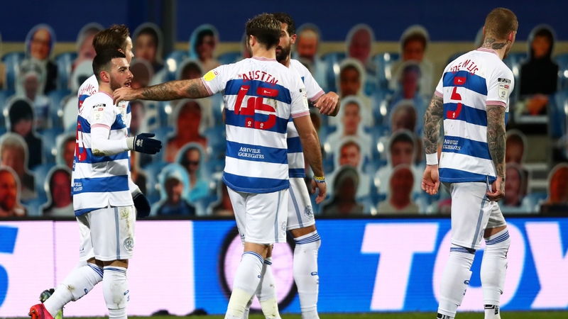 Ilias Chair is congratulated by QPR team-mate Charlie Austin