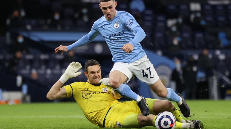Alex McCarthy (L) appeared to foul Man City's Phil Foden