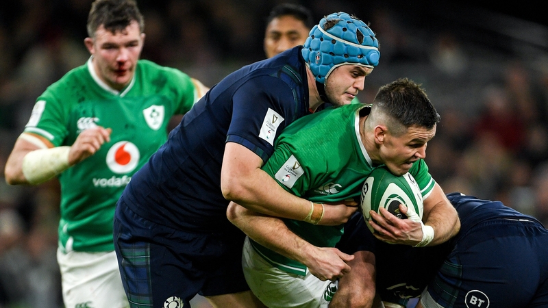 Ireland's Jonathan Sexton (R) is tackled by Scott Cummings during last year's Six Nations