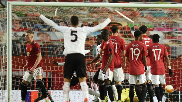 Diego Dalot celebrates AC Milan's late equaliser at Old Trafford