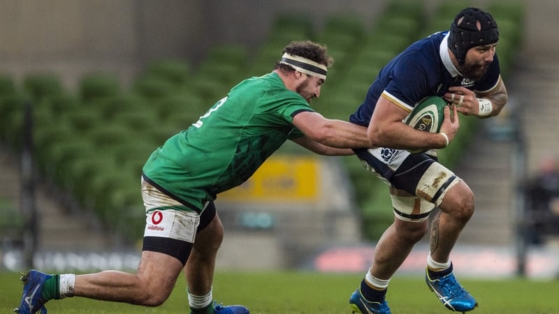 Rob Herring (left) tackles Scotland's Blade Thomson during the Autumn Nations Cup