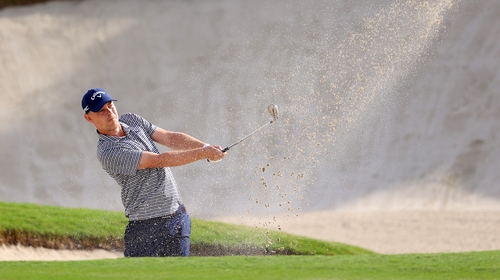 Jeff Winther plays from a bunker on the sixth hole, where he recorded the sole bogey of his round