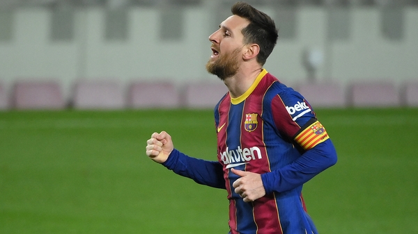 Leo Messi celebrates his second, and Barcelona's fourth goal against Huesca