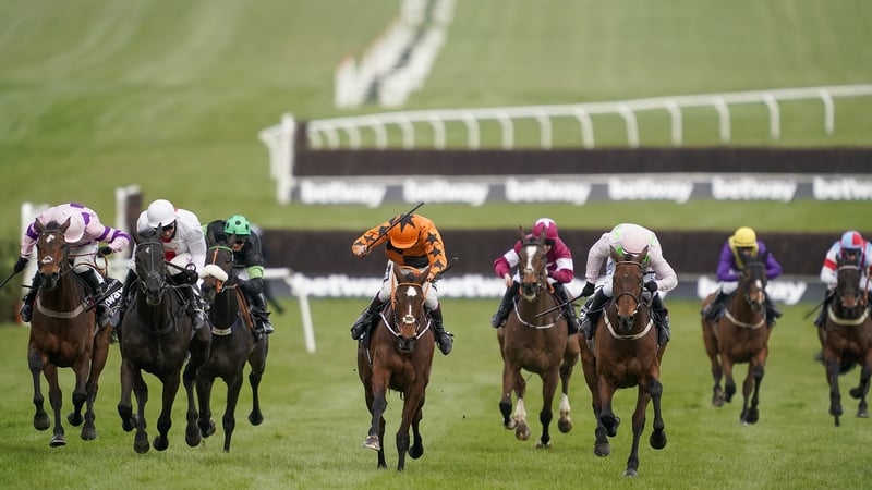 Aidan Coleman riding Put The Kettle On (orange) prevails on the run to the line