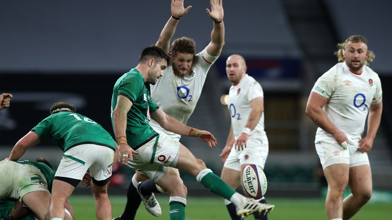 Conor Murray kicks past Johnny Hill during the 2020 Autumn Nations Cup