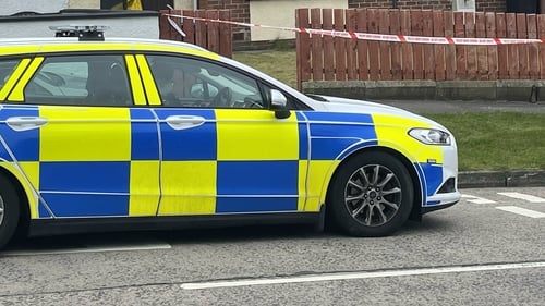 The three bodies were found at separate properties in Newtownabbey