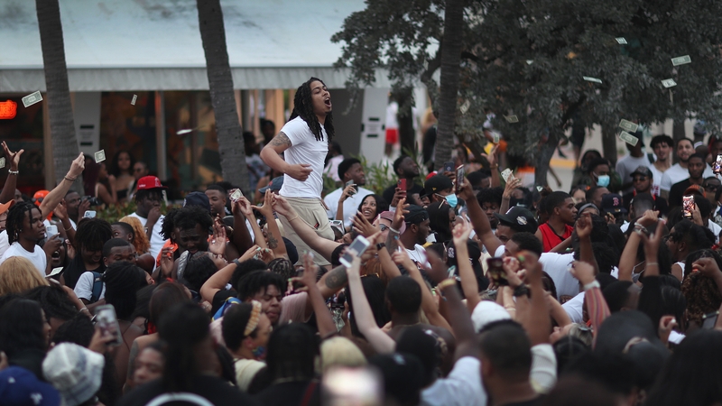People enjoy themselves along Ocean Drive in Miami Beach, Florida