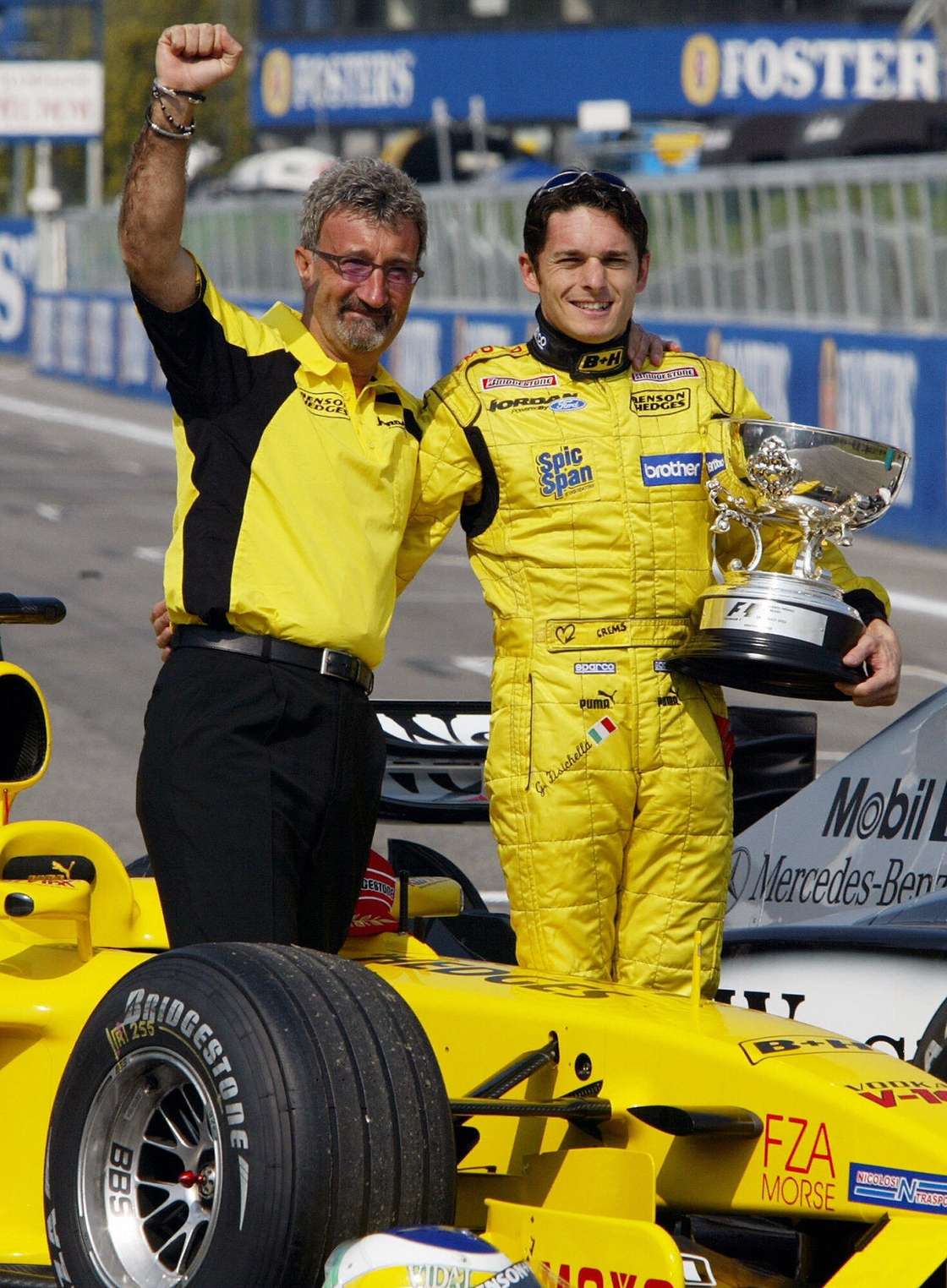 Fisichella (R) poses with his team manager Eddie Jordan (L) in 2003