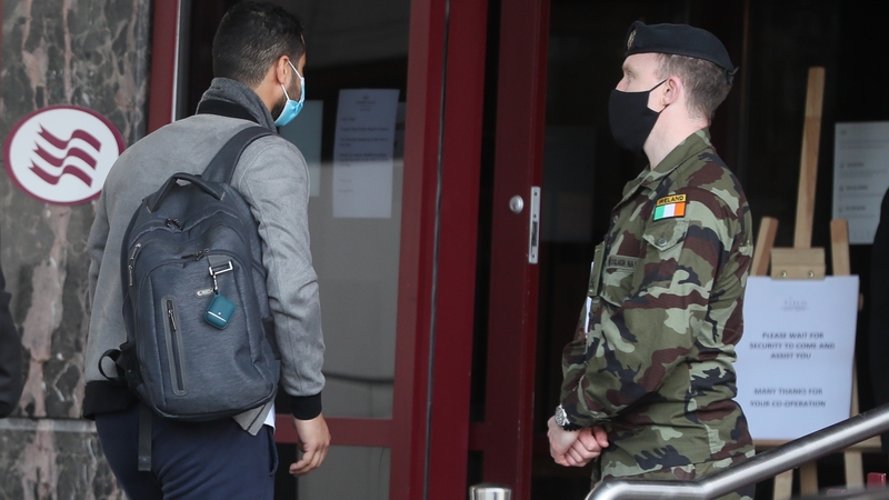 A traveller enters the Crowne Plaza hotel, Santry, near Dublin Airport, where he will stay during a mandatory 12-day quarantine