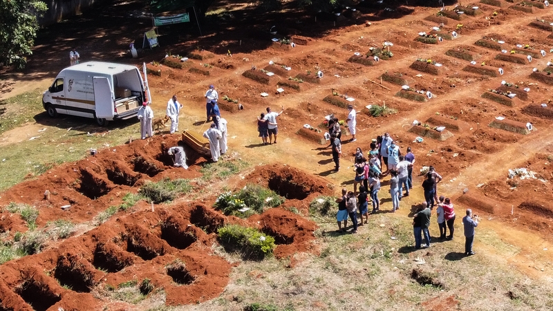 Workers at the Vila Formosa cemetery in Sao Paulo today, where bodies of coronavirus victims are buried