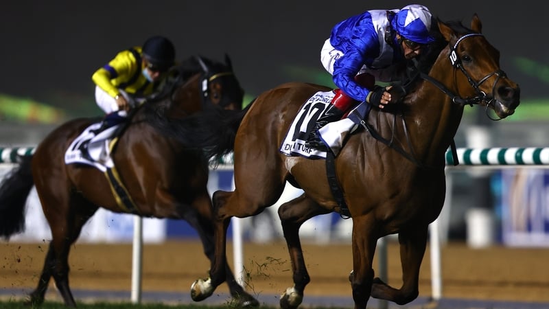 Frankie Dettori gives Lord North a pat down the neck as the duo cross the line in the Dubai Turf