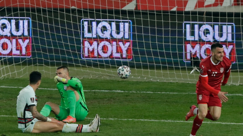 Filip Kostic celebrates his leveller for Serbia