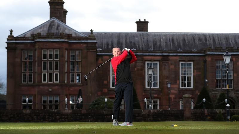 A golfer tees off at Vale Royal Abbey Golf Club, Cheshire, England this morning