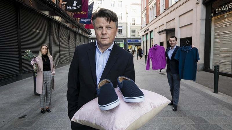 Siobhán Mac Court, Duncan Graham and Keelan Bourke of Retail Excellence display various 'non-essential' items purchased last week in shops near Grafton Street while the bulk of retailers on the street are forced to remain closed under Covid lockdown rules