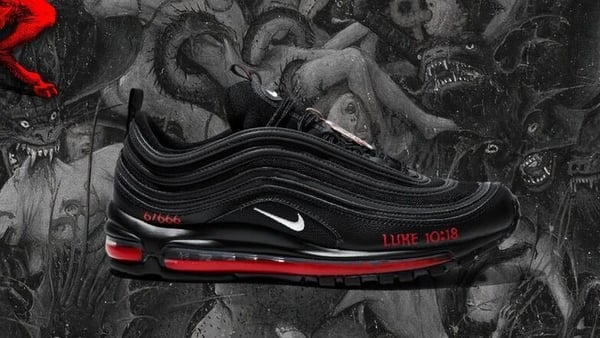 The black Nike Air Max 97s have been customised to feature a bronze pentagram, a Bible verse referring to Satan's fall and a drop of human blood mixed with red ink in the midsole (Pic: MSCHF website)